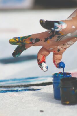 hand covered with paint
