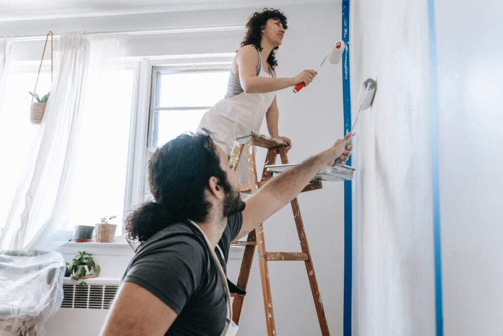 Couple painting walls
