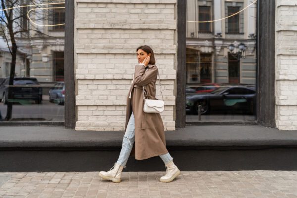 A fashionable girl walking through downtown toronto 