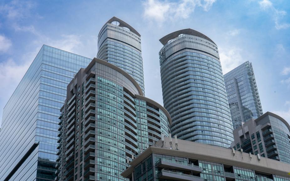 A group of tall buildings sitting next to each other