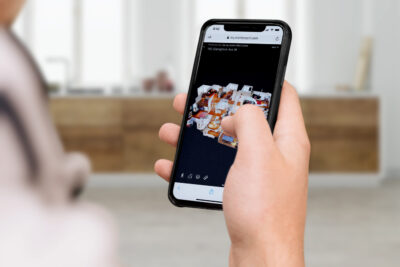 a person holding phone in one hand