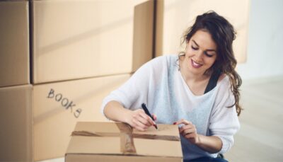 a woman writing in the box