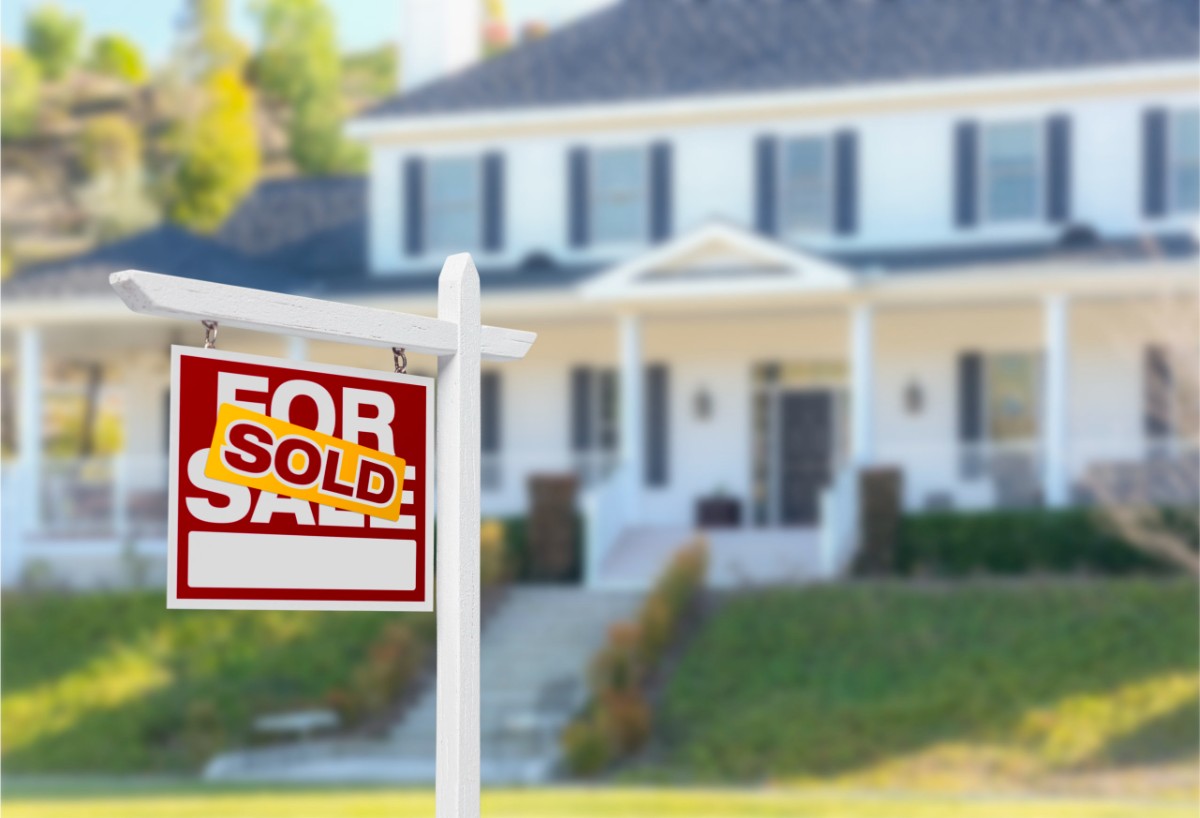 Sold Home For Sale Sign in Front of New House